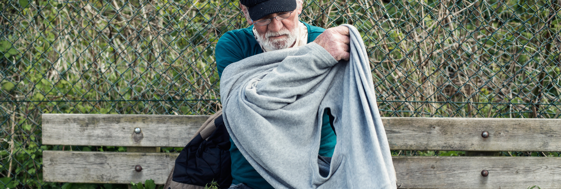 Man putting on a sweater